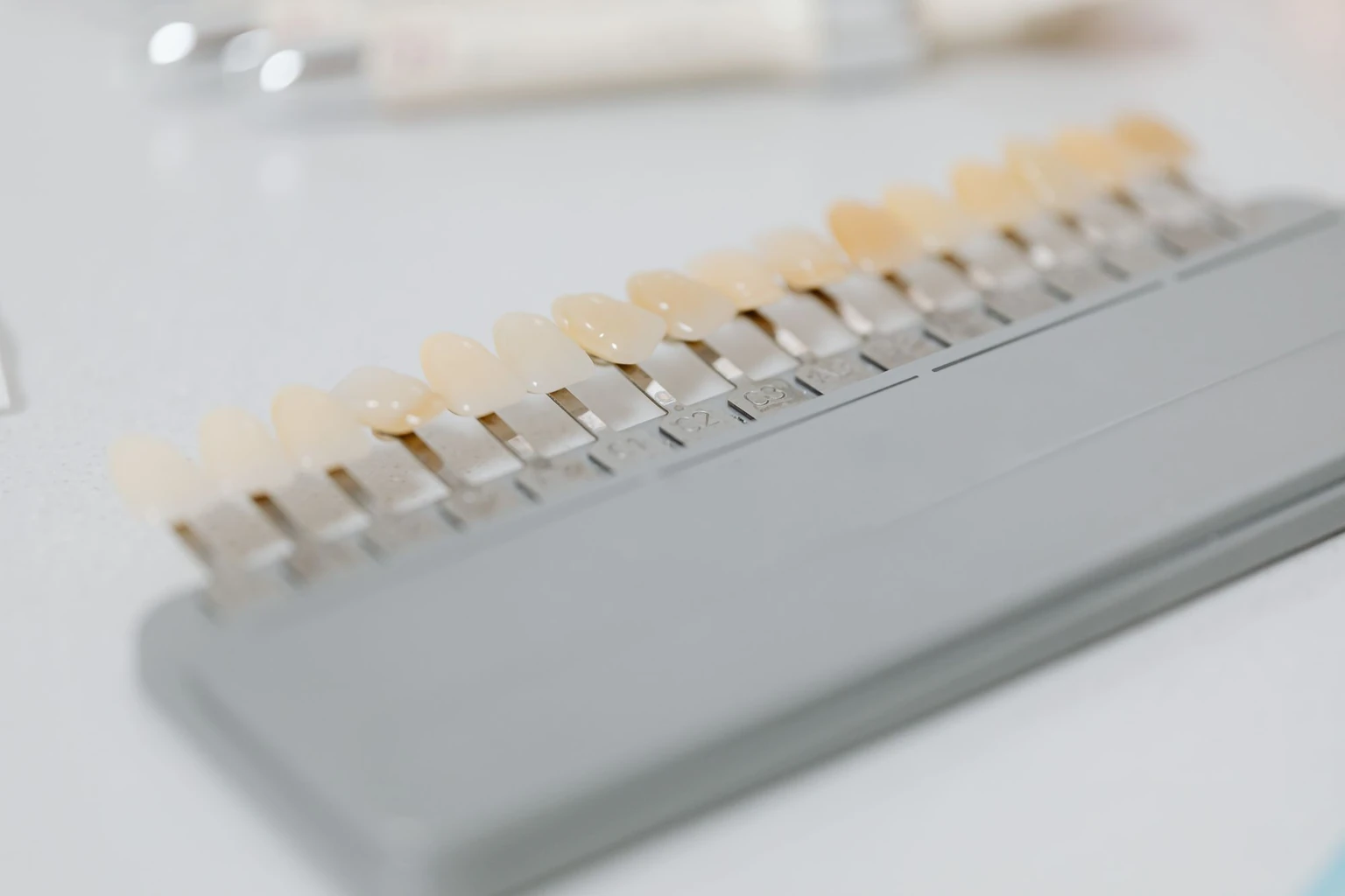 A dental shade guide of tooth-colour tabs used to match veneers, for a cosmetic dentistry evidence review