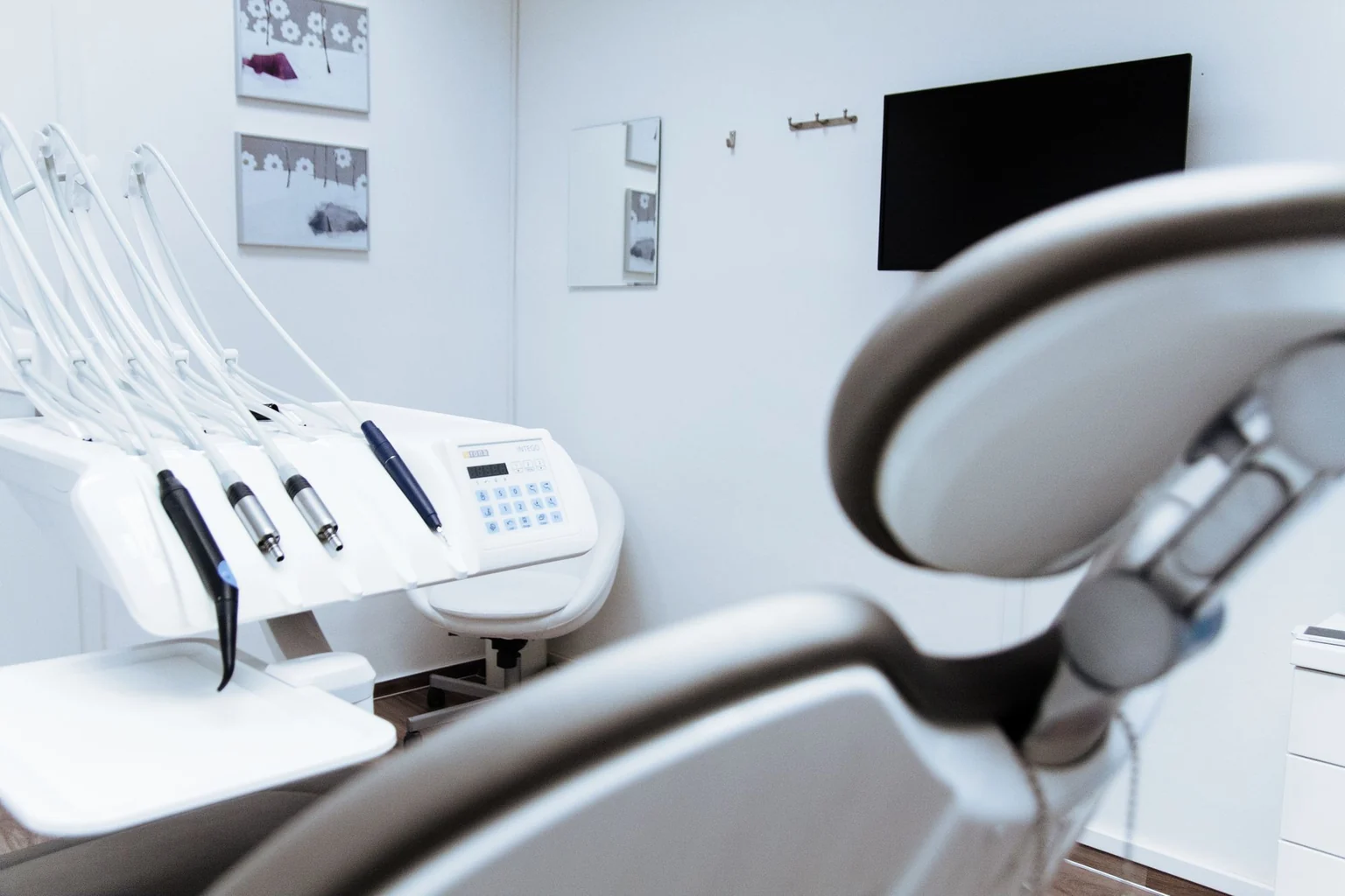 A dental professional delivering careful clinical care, the standard against which a registrant's treatment is judged